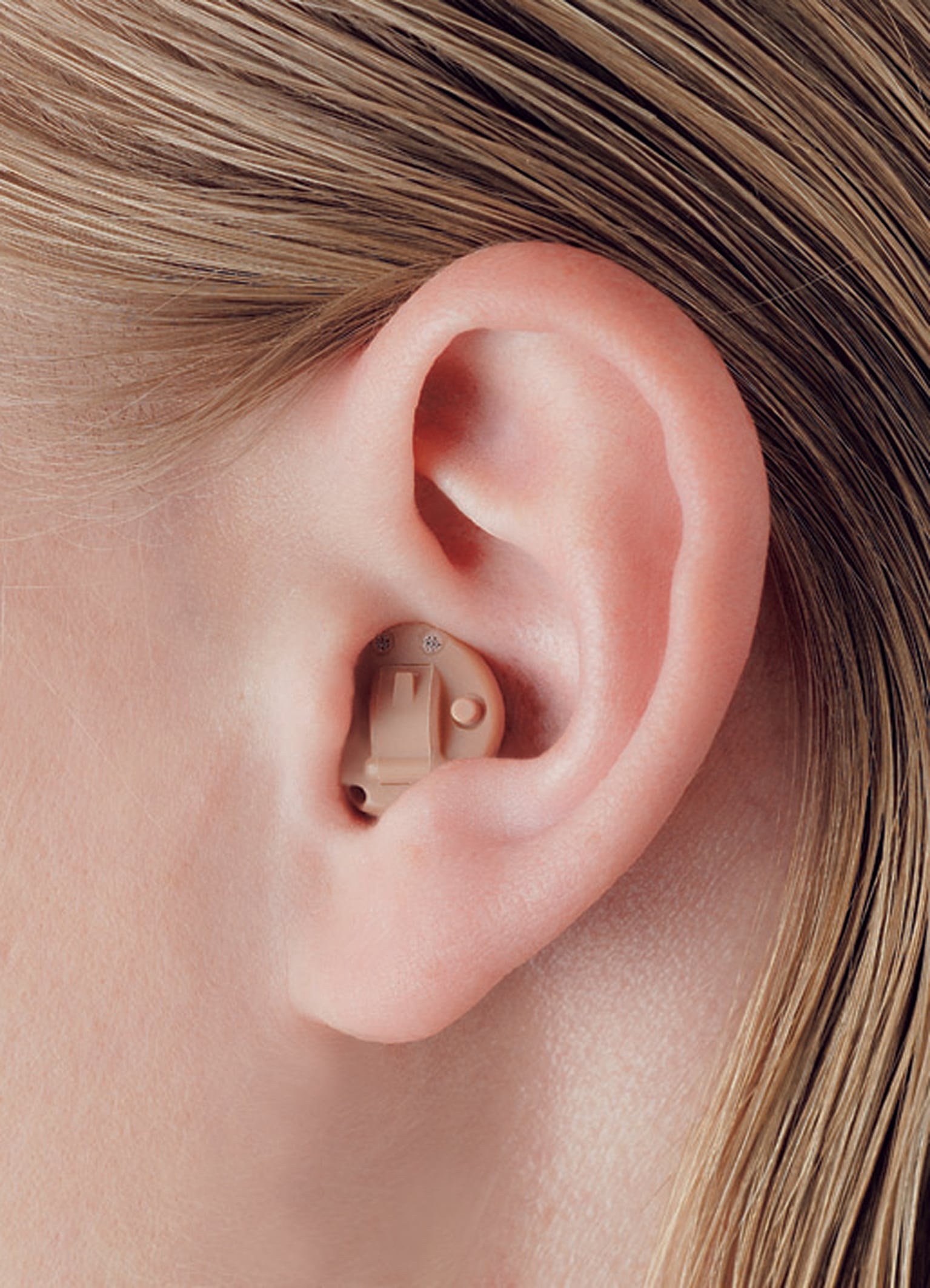 In-the-ear (ITE) hearing aid sitting inside the ear